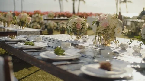 Beautifully decorated wedding table in white colours with exotic flowers in Stock Footage 101126838
