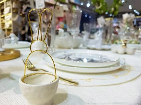 A beautifully laid table with decorations for the Easter holiday. Traditional Stock Photos