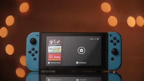 Beautifully lit Nintendo Switch loading up the main home screen. Stock Footage 132433218