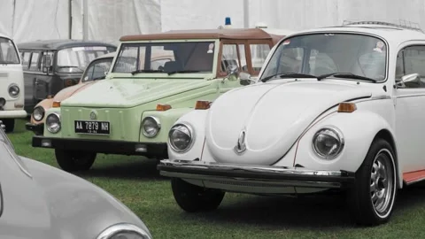 Beautifully maintained chrome painted classic Volkswagen Beatle cars parked Stock Footage 209117933