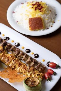 Beautifully plated Persian mixed grill including koobideh kebab Stock Photos