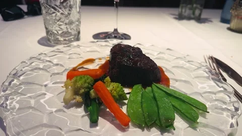A beautifully plated steak solomillo served in an elegant restaurant. The tender Stock Footage 330796496