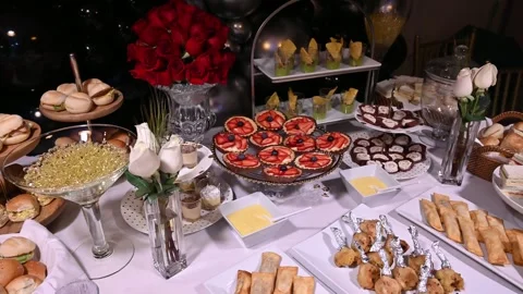 Beautifully served banquet table with different food snacks and appetizers on Stock Footage 262768430