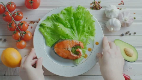Beautifully served fish steak on flat lay Stock Footage 99847249