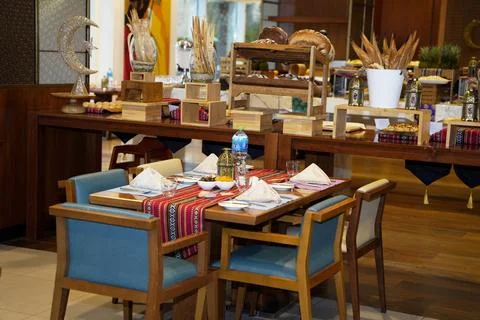 A beautifully set dining table featuring colorful linens and elegant tableware Stock Photos