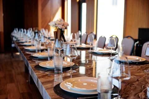Beautifully Set Dining Table Ready for an Elegant Dinner Event at a Riverside Stock Photos