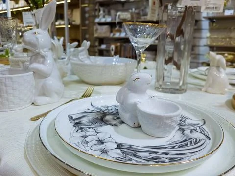Beautifully set table with decorations for the Easter holiday. A small porcelain Stock Photos
