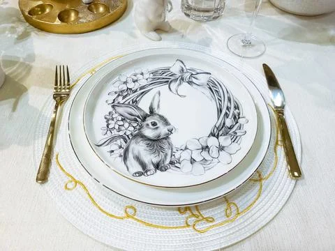 Beautifully set table with decorations for the Easter holiday. A small porcel Stock Photos