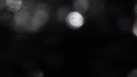 Beautifully shaped bokeh, special white color on black at the top Stock-Footage 317481553