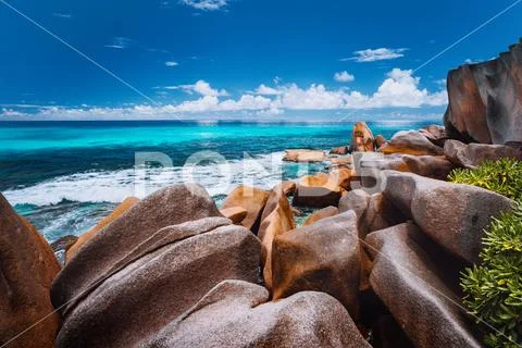 Beautifully shaped granite boulders on Grand Anse beach, La Digue island Stock Photos