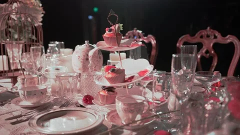 A beautifully styled high tea table arranged in a studio setting, featuring Stock Footage 333537555