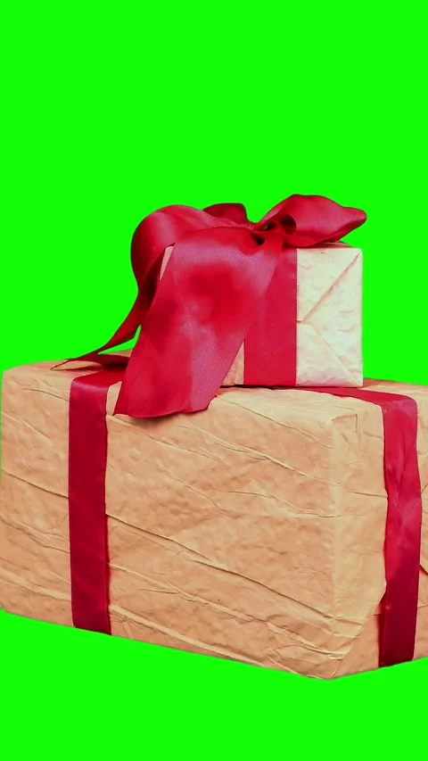 Beautifully wrapped gifts, presents isolated on green background. close-up, Stock Footage 323091653