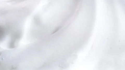 Beauty background with foam mousse, macro. Close up of white cloud of shavi.. Stock Footage 284420786