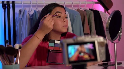 Beauty blogger lady doing a makeup she are concentrated recording vide Stock Footage 196731853