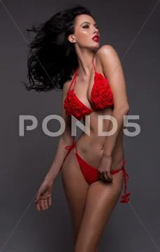 Beauty brunette wearing swim suit Stock Photos