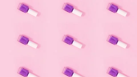 Beauty concept pattern made of nail polishes bottles rotate. Stop motion Stock-Footage 155047692