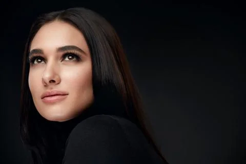 Beauty Face Makeup. Beautiful Smiling Woman With Makeup On Black Stock Photos