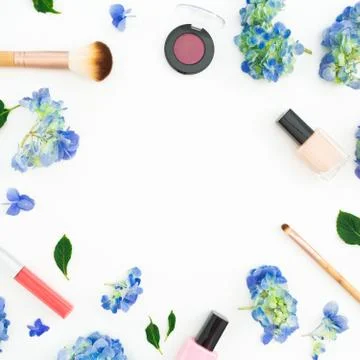 Beauty frame composition of hydrangea flowers with cosmetics on white backgro Stock Photos