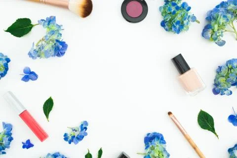 Beauty frame composition of hydrangea flowers with cosmetics on white backgro Stock Photos