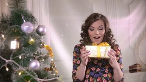 Beauty girl with christmas gift box. Young cute woman happy getting present Stock Footage