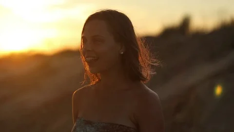 Beauty Girl with Healthy Long Hair Outdoors. Happy Smiling Young Woman Enjoying Stock Footage