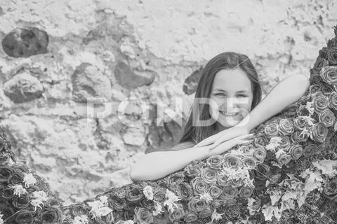 Beauty girl with long hair smile with floral decor, spring Stock Photos
