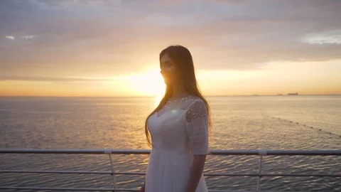 Beauty girl on sky background in a white dress in the sea. beautiful bride Stock Footage