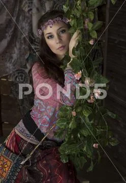 Outdoor fashion: the beautiful young boho (hippie) girl in grove