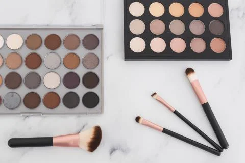 Beauty industry and make-up products, eyeshadow palettes with nudes and bronz Stock Photos