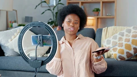 Beauty influencer filming a makeup tutorial at home. Young female blogger live Stock Footage 255255579