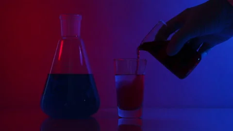 Beauty lab. Laboratory flasks with red and blue liquid. Blue and red neon color. Stock Footage 142693259