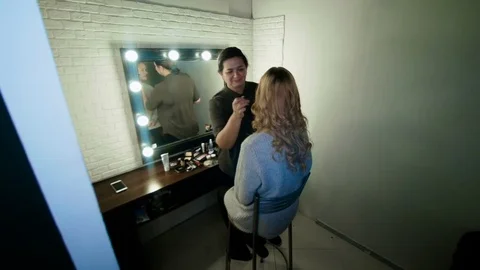 The beauty-master does the makeup of an beautiful girl 스톡 동영상 82079010