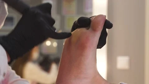 A beauty master does a pedicure Stock Footage 197970874