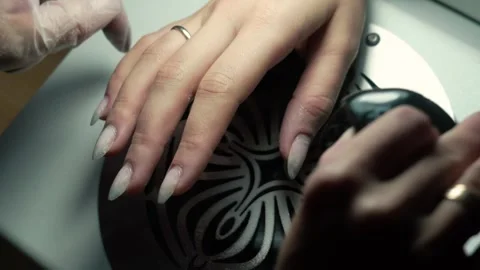 Beauty master doing nails young girl in salon, female beauty and self-care Video stock 329030272