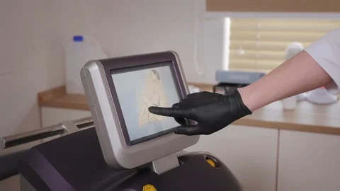 Beauty master selects area of work on touch screen of device Stock Footage 196063000