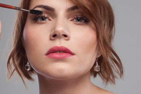 Beauty model style. Makeup tutorial closeup Stock Photos