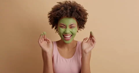 Beauty model with surprised face expression stares at camera looks at her dirty Stock Footage 145715785