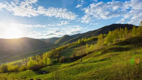 The beauty of nature, clouds over simple mountain landscape timelapse at suns Stock Footage 129694742