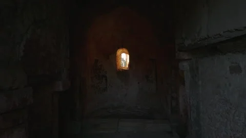 Beauty of old chapel window light illuminating historic stone walls Stock Footage 321495189