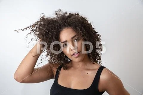 Beauty portrait of african american woman with afro hairstyle and glamour mak Stock Photos