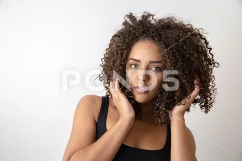 Beauty portrait of african american woman with afro hairstyle and glamour mak Stock Photos