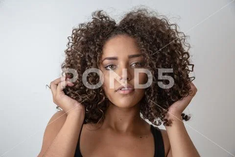 Beauty portrait of african american woman with afro hairstyle and glamour mak Stock Photos