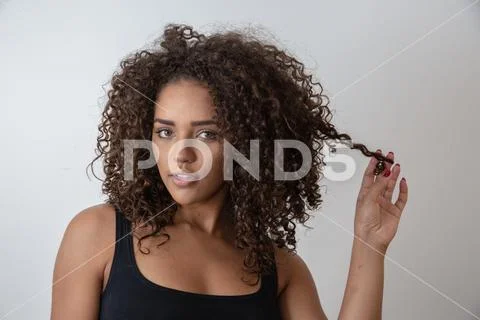 Beauty portrait of african american woman with afro hairstyle and glamour mak Stock Photos