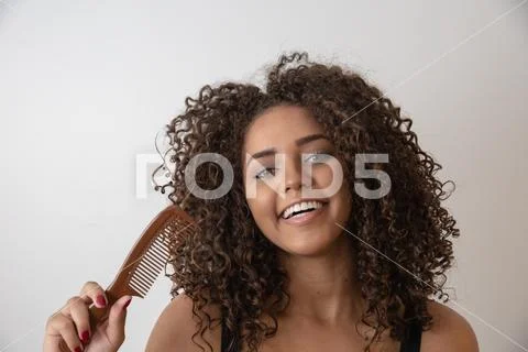 Beauty portrait of african american woman with afro hairstyle and glamour mak Stock Photos