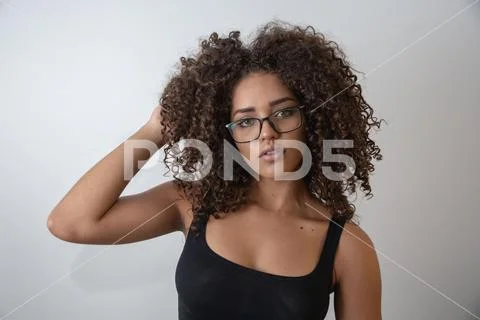 Beauty portrait of african american woman with afro hairstyle and glamour mak Stock Photos