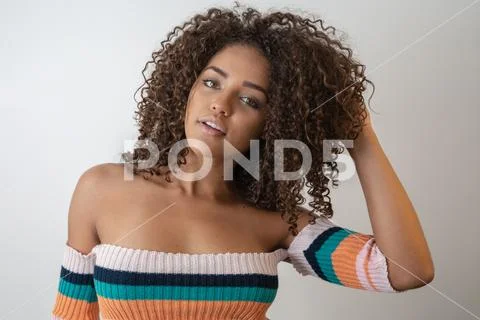 Beauty portrait of african american woman with afro hairstyle and glamour mak Stock Photos