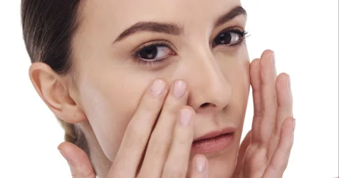 Beauty portrait of woman touching beautiful face in slow motion skincare concept Stock Footage