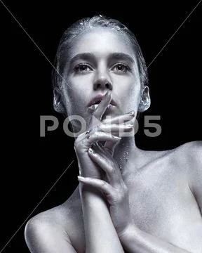 Beauty portrait of young gorgeous woman. Female with hand near face on black Stock Photos