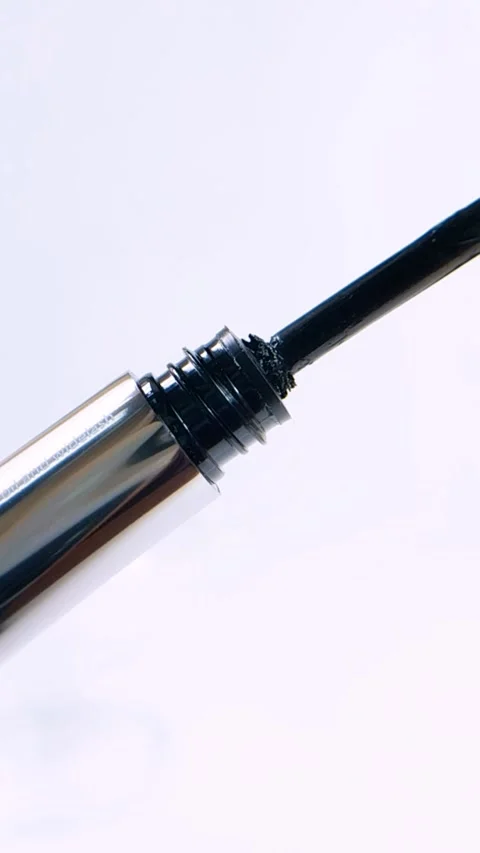 Beauty product for eyebrows featuring silver packaging and brush applicator.. Stock Footage 339778333