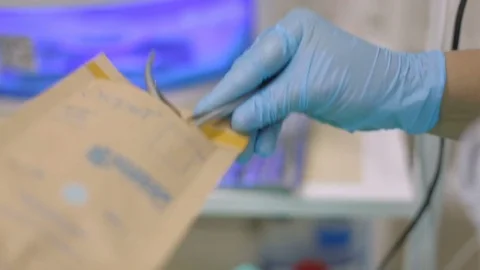 The beauty salon master pulls out cuticle cuticles from a paper bag Stock Footage 81097083